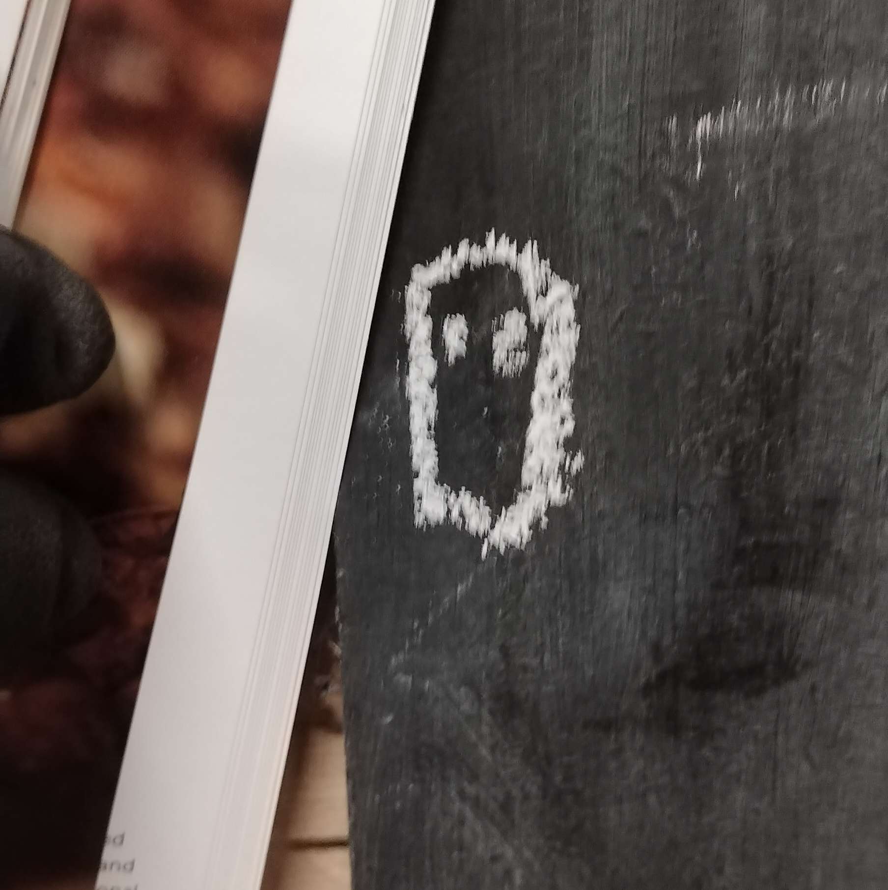 A Ghost Drawn In White Chalk On A Blackboard